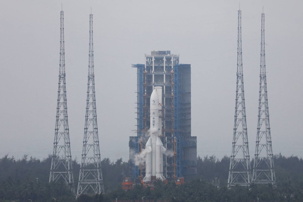 The Chang'e 6 lunar probe and the Long March-5 Y8 carrier rocket combination sit atop the launch pad at the Wenchang Space Launch Site in Hainan province, China May 3, 2024. (AFP)