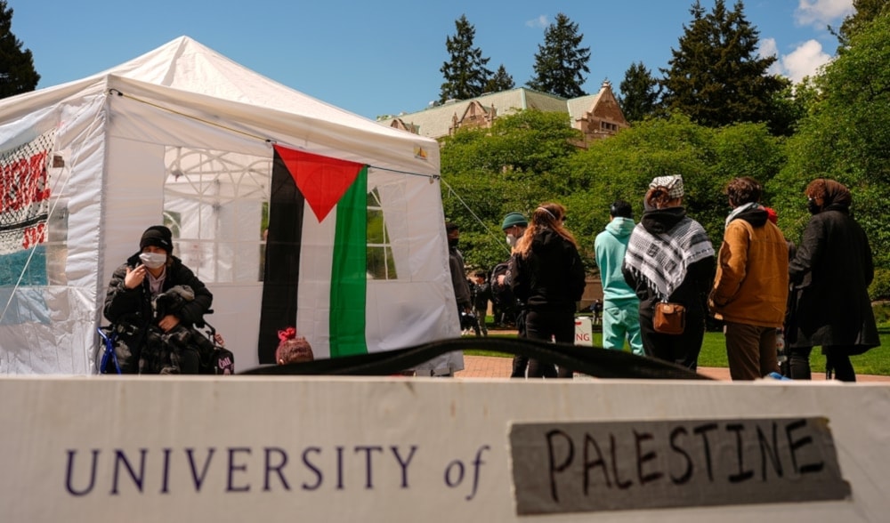 A sign is shown written over to read University of Palestine at A pro-Palestinian encampment on the University of Washington campus Monday April 29, 2024, in Seattle. (AP)