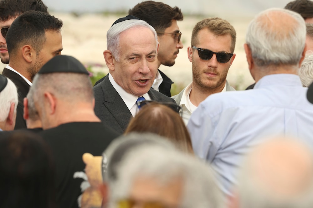 Israeli Prime Minister Benjamin Netanyahu speaks during a ceremony at the Nahalat Yitshak Cemetery in Tel Aviv, occupied Palestine, June 18, 2024 (AP)