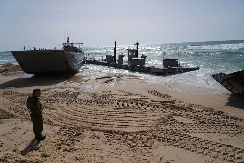 A US Army landing craft is seen beached in Ashdod, May 26, 2024, after being swept by wind and current from the temporary humanitarian pier in the Gaza Strip (AP)