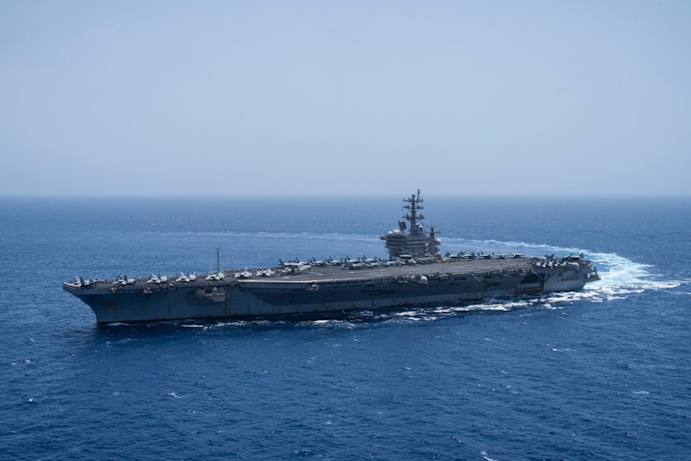 FILE - The USS aircraft carrier Dwight D. Eisenhower, also known as 'IKE', sails in the Red Sea on Wednesday, June 12, 2024. (AP Photo/Bernat Armangue, File)
