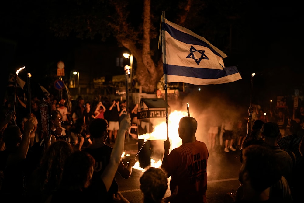 People protest against Israeli Prime Minister Benjamin Netanyahu's government and call for the release of captives held in the Gaza Strip in Tel Aviv, occupied Palestine, June 22, 2024 (AP)