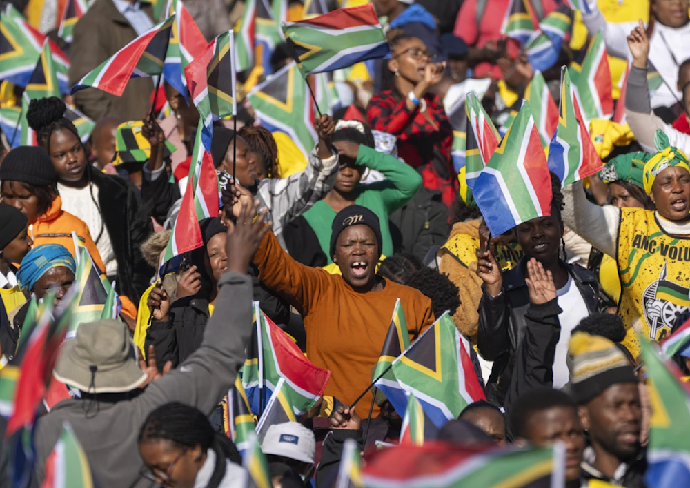 South Africans gather ahead of the inauguration of South Africa's Cyril Ramaphosa as President at the Union Buildings South Lawns in Pretoria on June 19, 2024. (AP)