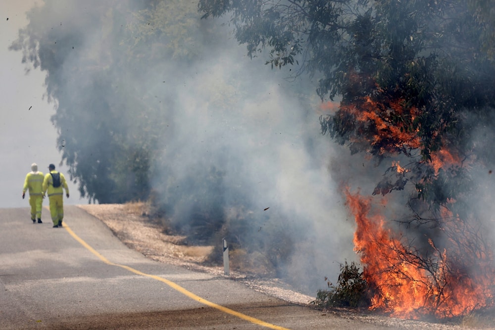 Flames in a field in the Banias area of upper al-Jalil sparked by rockets launched from southern Lebanon on June 9, 2024 in support of Gaza and in response to ongoing Israeli aggression on Lebanon. (AFP)