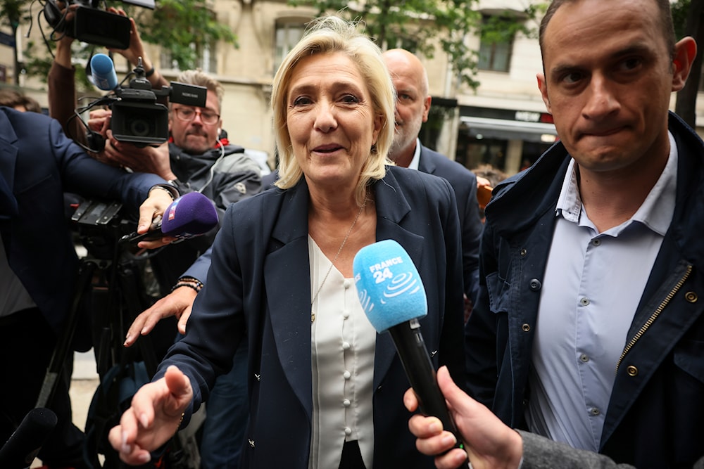 French far-right leader Marine Le Pen arrives at the National Rally party headquarters, Monday, June 10, 2024 in Paris. (AP)