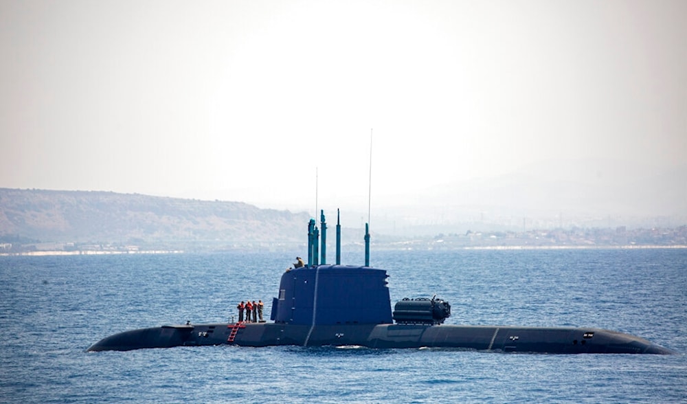 An Israeli occupation Navy submarine is seen near 'Israel's' offshore Leviathan gas field in the Mediterranean Sea, Wednesday, Sept. 1, 2021. (AP)