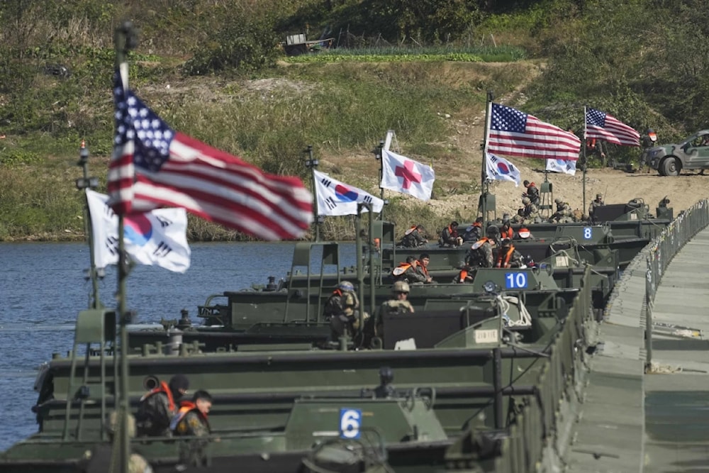 US and South Korean flags wave before a joint river-crossing drill between the allied nations in Yeoju, South Korea, October 19, 2022. (AP)