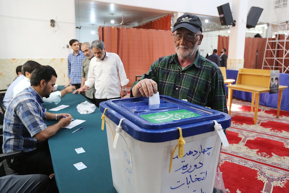 Polling stations open, Iranians head to vote in presidential elections