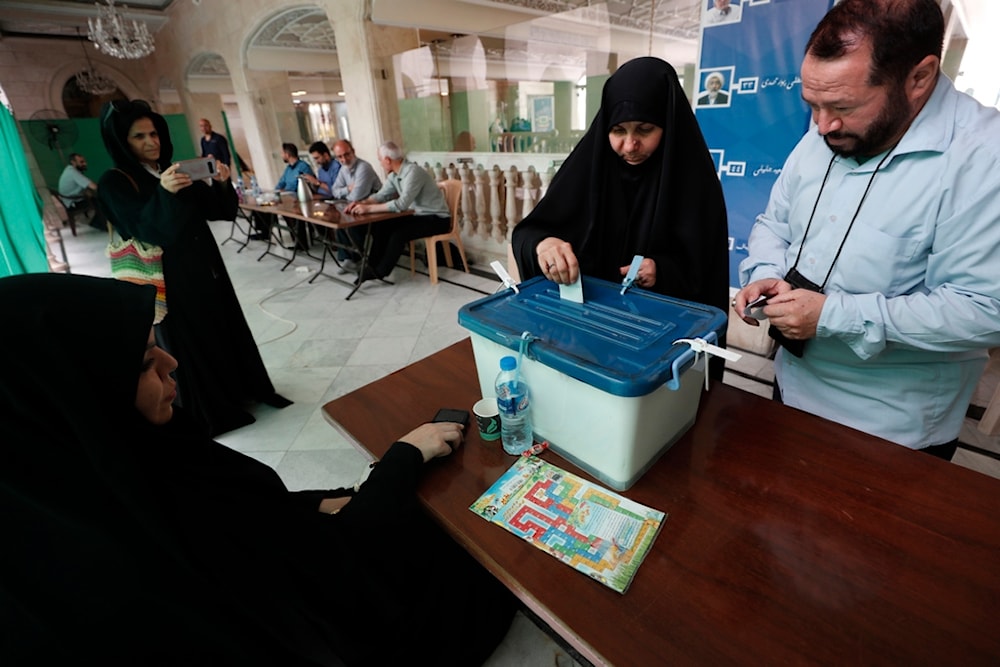 Iranian citizens who live in Syria cast their ballots for the presidential election at a polling station, in Damascus, Syria, Friday, June 28, 2024. (AP)