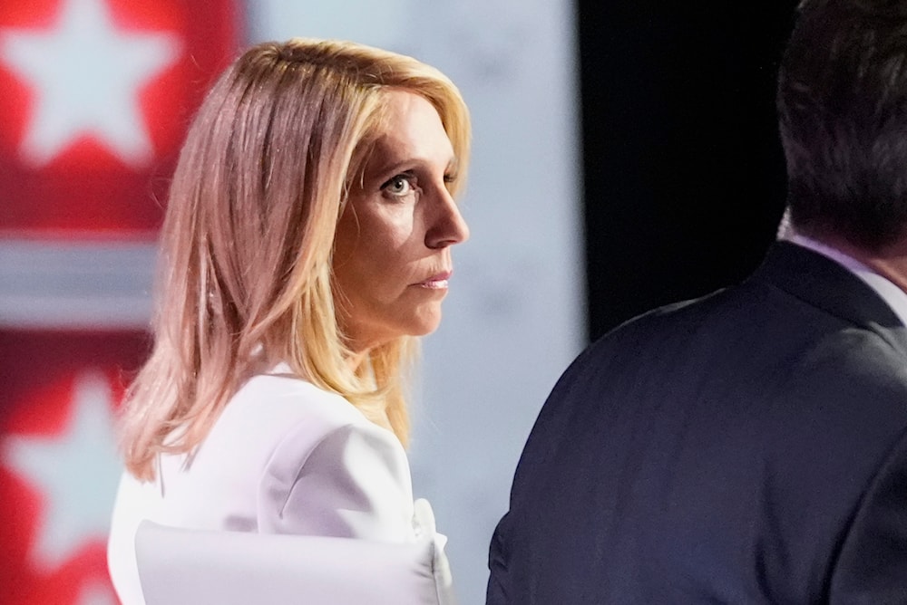CNN's Dana Bash listens as she and Jake Tapper moderate the debate between President Joe Biden and Republican presidential candidate Donald Trump, Thursday, June 27, 2024, in Atlanta. (AP)