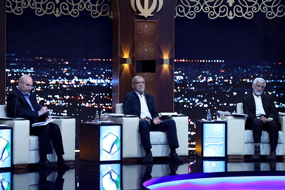 In this picture made available by Iranian state-run TV, IRIB, shows presidential candidates Masoud Pezeshkian, center, Mohammad Bagher Qalibaf, left, and Saeed Jalili in Tehran, Iran, June 17, 2024 (AP)