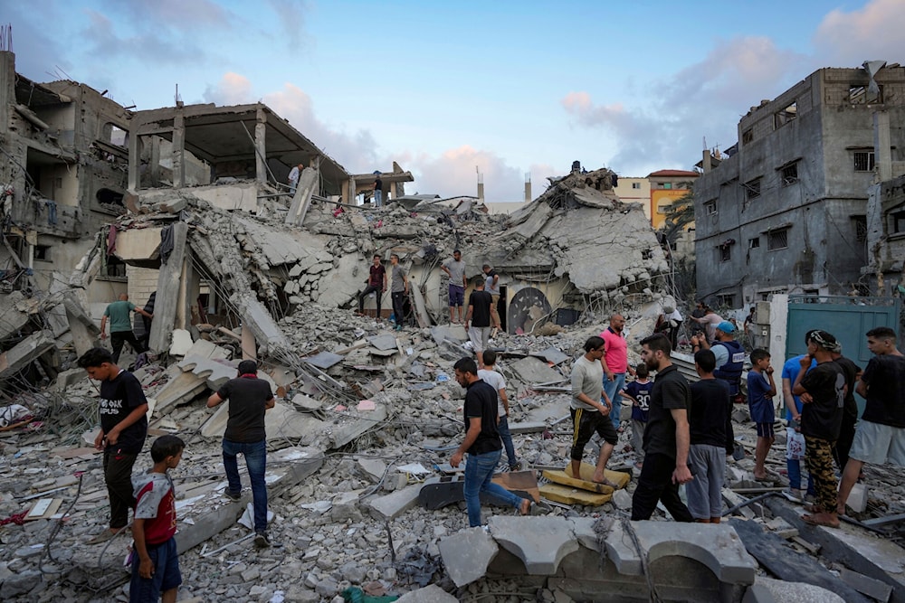 Palestinians look at the destruction after an Israeli airstrike in Deir al Balah, Gaza Strip, Tuesday, April 30, 2024. (AP)