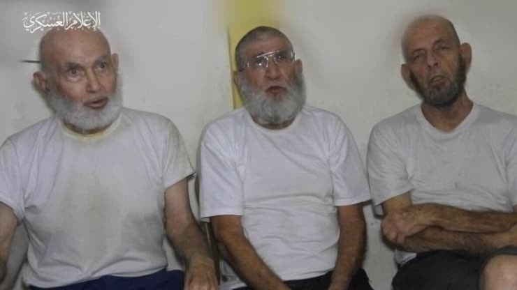 Three Israeli settlers shown in a video released by the al-Qassam Brigades in December, 2023 (screengrab)