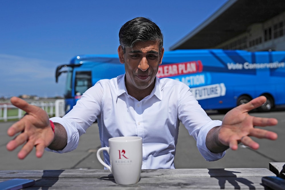 Britain's Prime Minister Rishi Sunak speaks to journalists at Redcar racecourse as launches the Conservative campaign bus, Saturday, June 1, 2024 in Redcar, England. (AP)