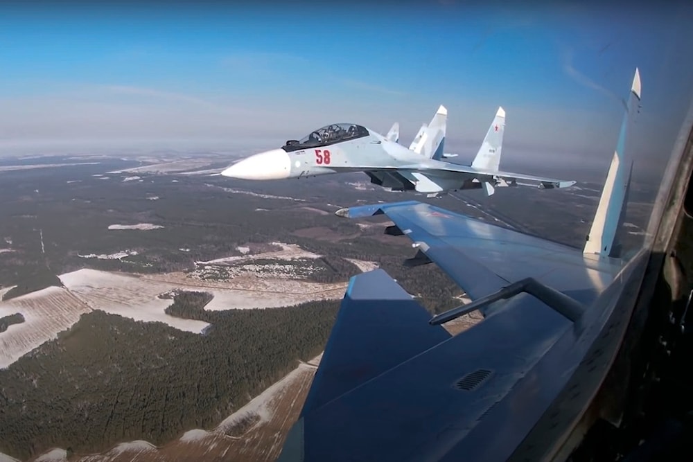 Screengrab by the Russian Defense Ministry Press Service on Feb. 17, 2022, Su-30 fighters of both air forces fly in a joint mission during the Union Courage-2022 Russia-Belarus drills in Belarus. (AP)