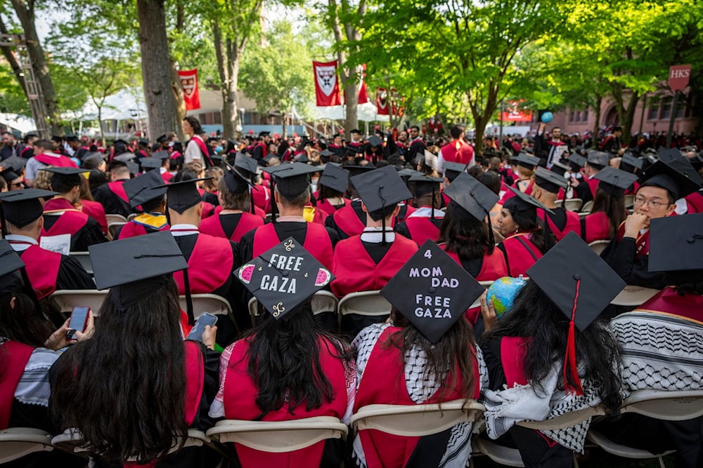 Students wear signs supporting Palestinians in Gaza on their mortarboards during commencement in Harvard Yard, at Harvard University, in Cambridge, Mass., Thursday, May 23, 2024. (AP)