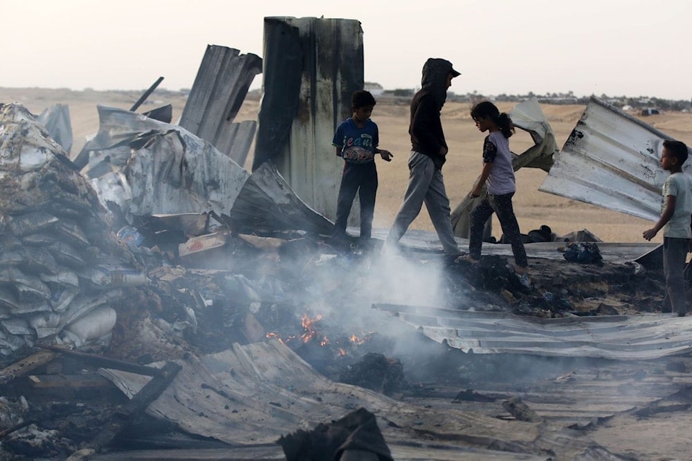 Palestinian kids near camp tents in Tal Al Sultan after being bombed by Israeli airplanes overnight on May 28, 2024. (UNRWA)