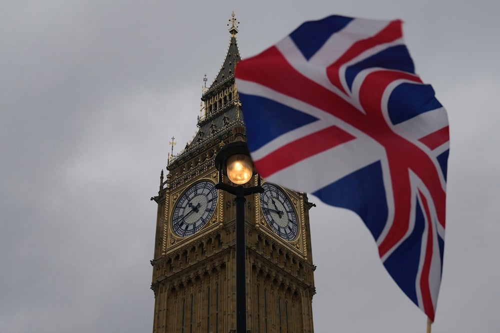 A Union flag is displayed outside the Houses of Parliament, in London, Thursday, May 23, 2024. (AP)