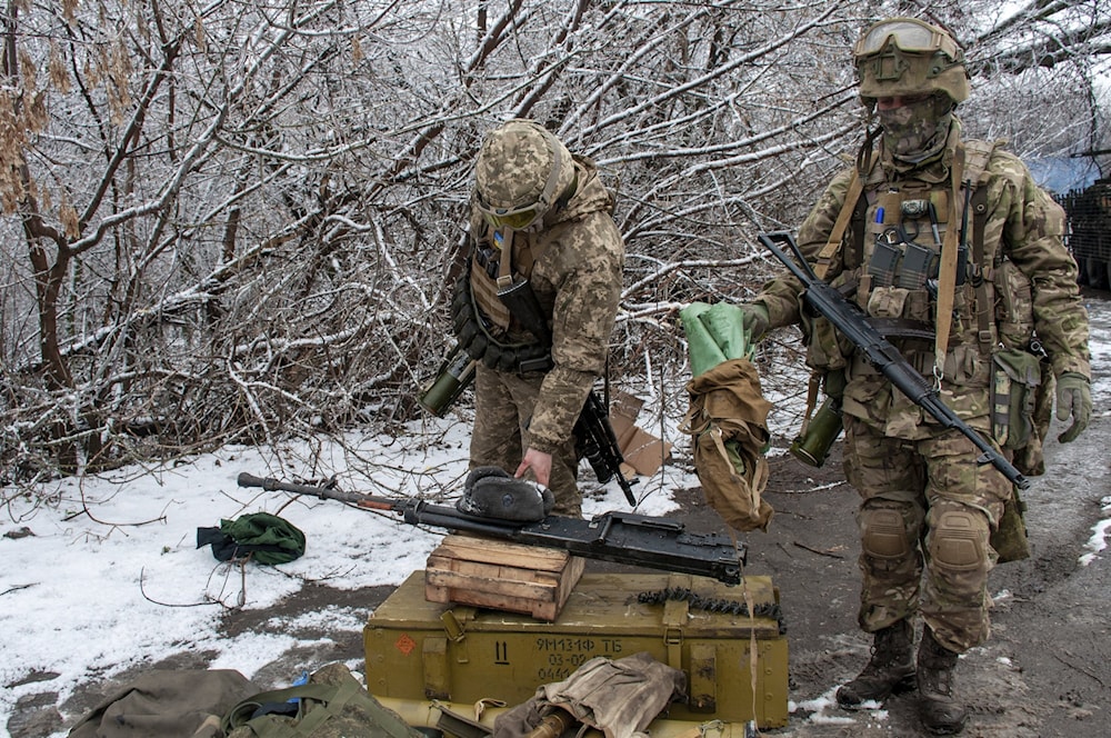 Illustrative: Ukrainian soldiers handle equipment outside Kharkiv, Ukraine, Feb. 26, 2022. (AP)