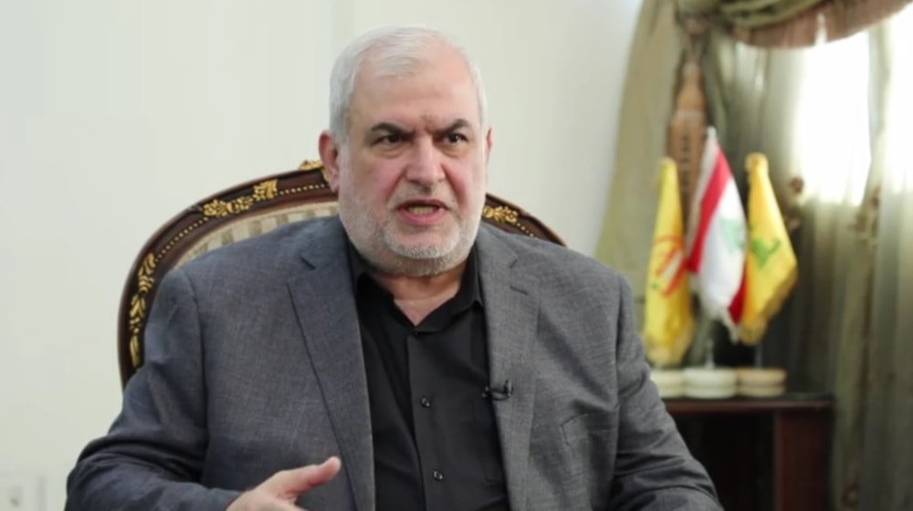 Mohammad Raad, head of Hezbollah’s Loyalty to the Resistance Bloc in the Lebanese parliament, speaks in an interview with Iran’s Arabic-language al-Alam television news channel broadcast on June 4, 2024. (AP)