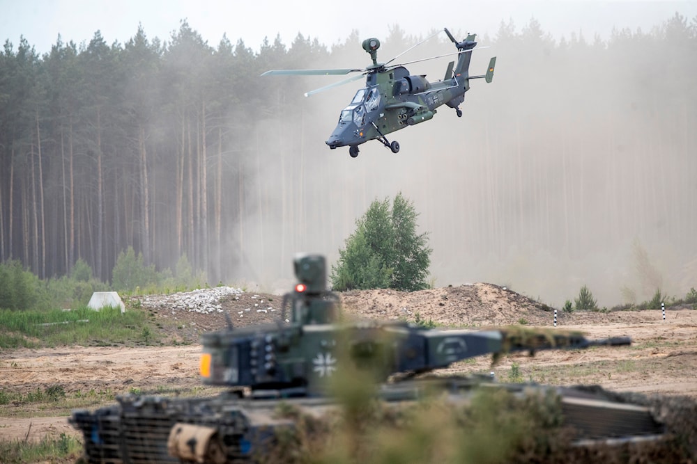 Eurocopter Tiger of the German Army takes part in the Lithuanian-German division-level international military exercise 'Grand Quadriga 2024' at a training range in Vilnius, Lithuania, May 29, 2024 (AP)