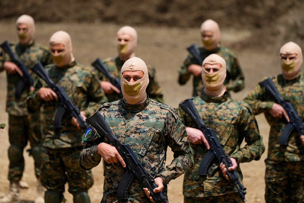 Fighters from the Lebanese Resistance Hezbollah carry out a training exercise in Aaramta village in the Jezzine District, southern Lebanon, Sunday, May 21, 2023 (AP Photo/Hassan Ammar)