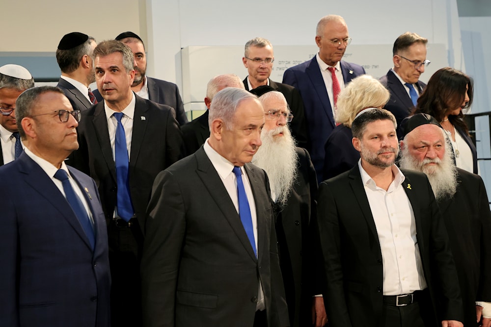 Israeli Prime Minister Benjamin Netanyahu, center, arrives a Cabinet meeting in occupied al-Quds, occupied Palestine, June 5, 2024 (AP)