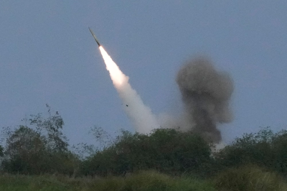 A US M142 High Mobility Artillery Rocket System (HIMARS) fires a missile during a Combined Joint Littoral Live Fire Exercise at the Balikatan joint military exercise in a Naval station in Zambales province, northern Philippines, April 26, 2023 (AP)