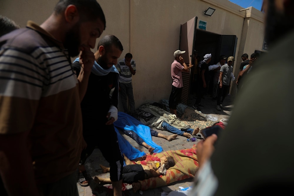 Palestinian children killed in the Israeli bombardment of the Gaza Strip are brought to al-Aqsa Hospital in Deir al-Balah, central Gaza Strip, Saturday, June 8, 2024 (AP Photo/Ismael Abu Dayyah)