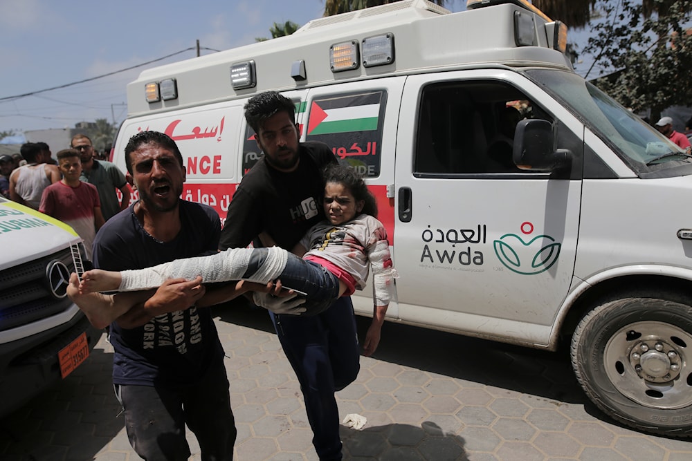 Palestinians wounded in the Israeli bombardment of the Gaza Strip arrive at al-Aqsa Hospital in Deir al Balah on  June 8, 2024.