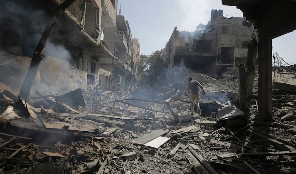 Palestinians look at the aftermath of the Israeli bombing in Nuseirat refugee camp, Gaza Strip, Palestine, June 8, 2024. (AP)