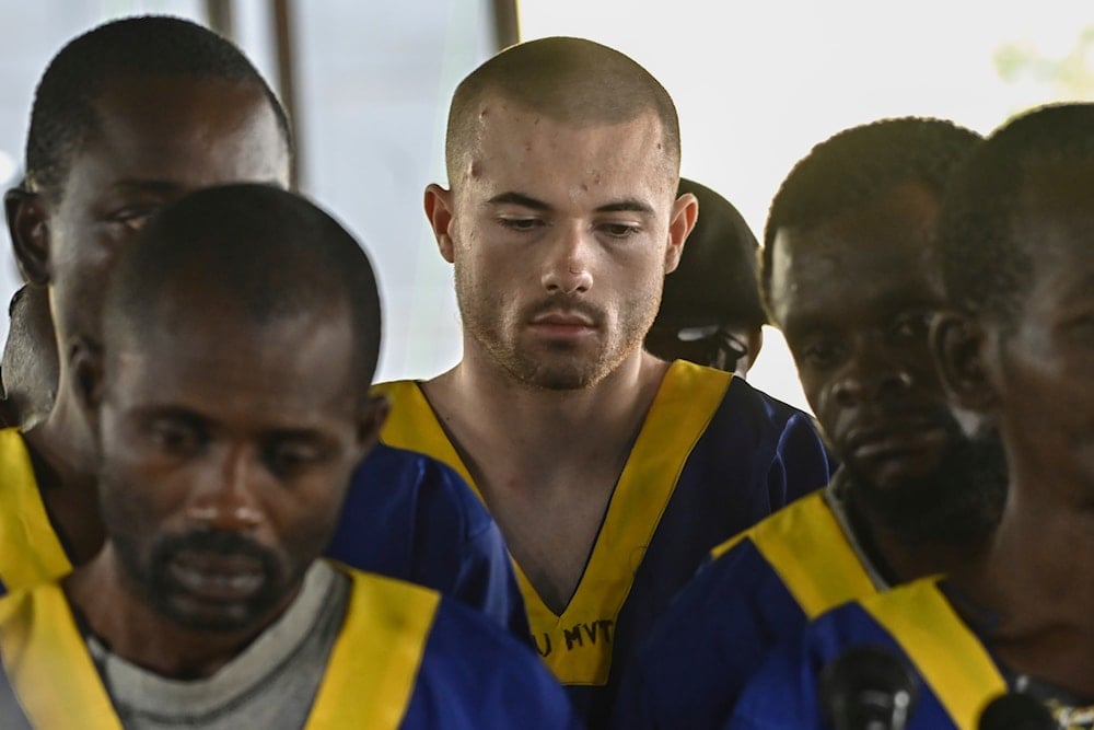 American Tyler Thompson Jr, center, sits in court in Kinshasa, Friday, June 7, 2024. (AP)