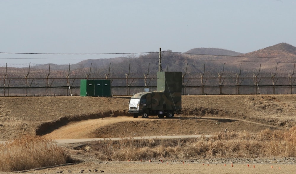 A South Korean military vehicle with loudspeakers is seen in front of the barbed-wire fence in Paju, near the border with North Korea, on Feb. 15, 2018. (AP)