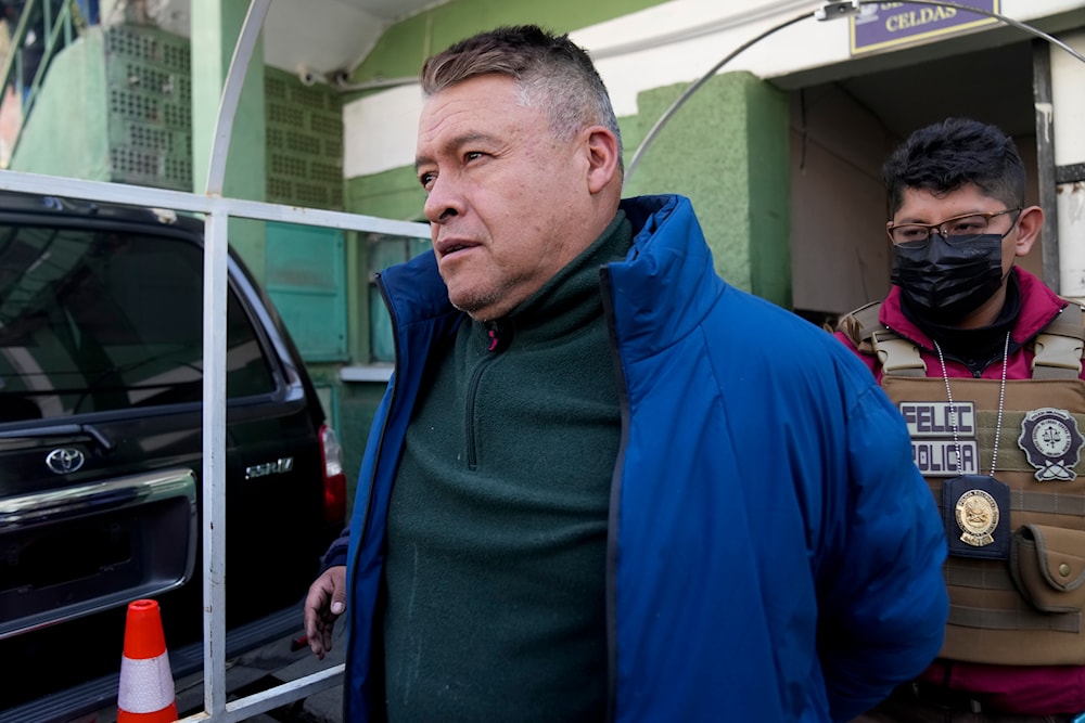 Juan Jose Zuniga, former commanding general of the army, is escorted from a jail to be taken to Chonchocoro maximum security prison, in La Paz, Bolivia, June 29, 2024 (AP)