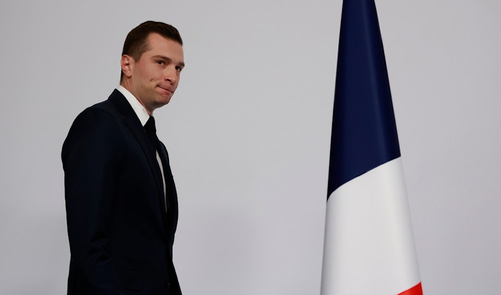Far-right National Rally party president Jordan Bardella arrives to deliver his speech after the first round vote of the legislative election, Sunday, June 30, 2024 in Paris. (AP)