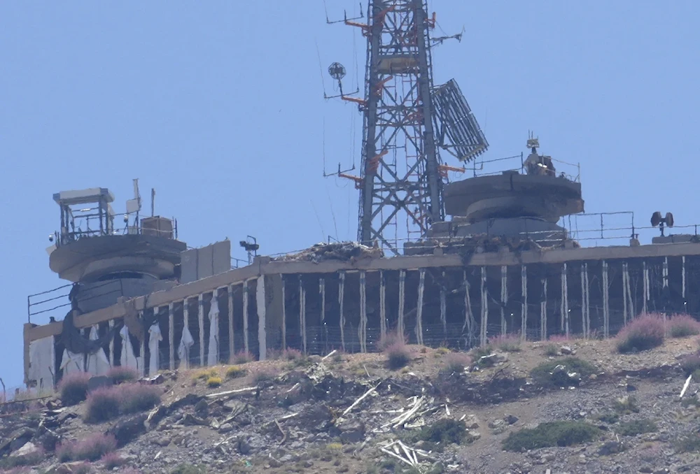 A damage Israeli military position targeted by Hezbollah resistance fighters is seen on the top of Mount Hermon in the occupied Golan Heights on June 26, 2024. (AP)