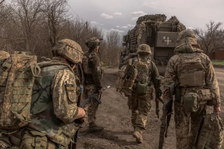 Ukrainian troops on their way towards the front line in Donetsk on 8 Apr 2024 (AFP)