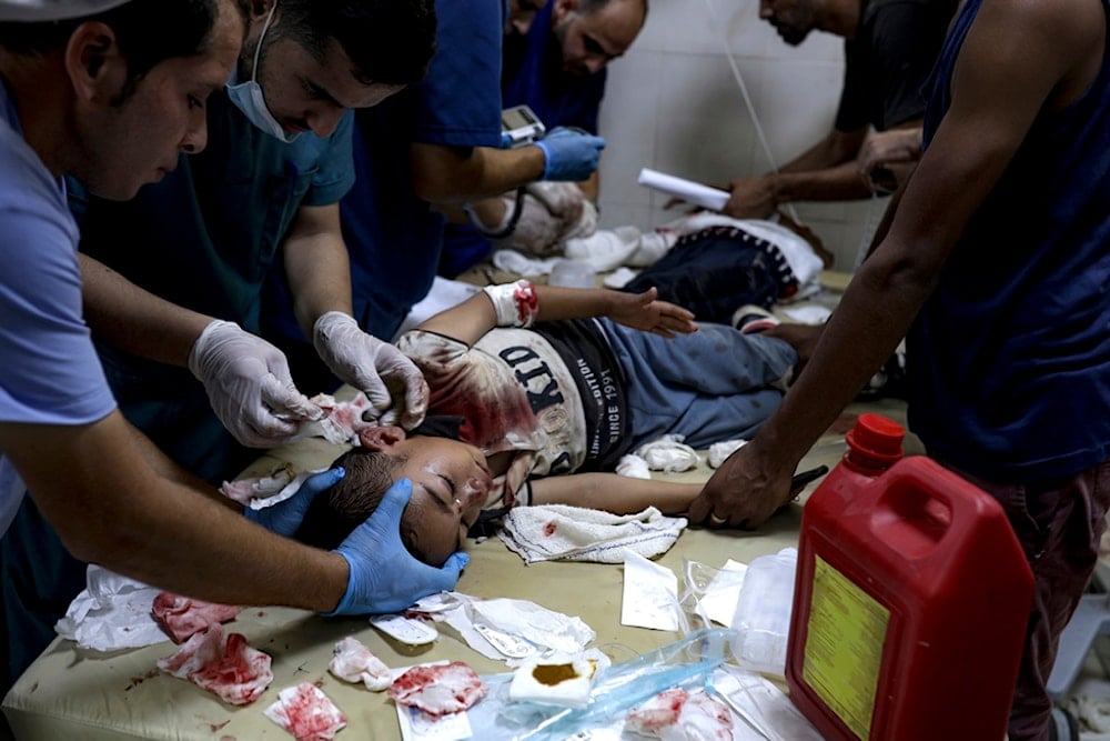 A Palestinian boy wounded in the Israeli bombardment of the Gaza Strip is treated in a hospital in Khan Younis, Tuesday, July 9, 2024. (AP)