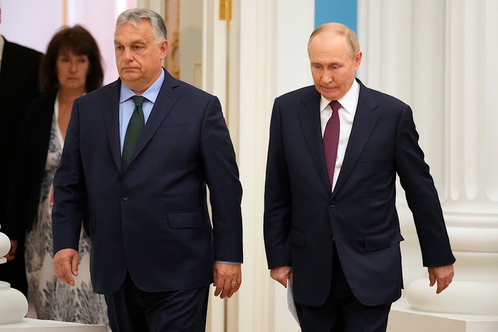 Russian President Vladimir Putin, right, and Hungarian Prime Minister Viktor Orban walk to attend a joint news conference following their talks in the Kremlin in Moscow, Russia, Friday, July 5, 2024. (AP)