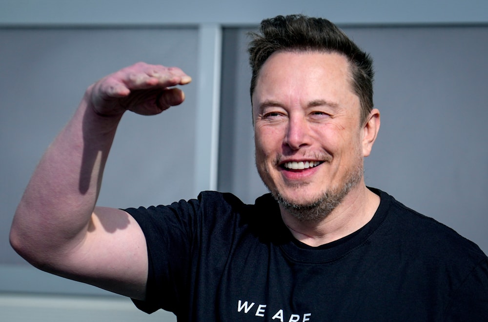 Tesla CEO Elon Musk waves as he leaves the Tesla Gigafactory for electric cars in Gruenheide near Berlin, Germany on March 13, 2024. (AP)