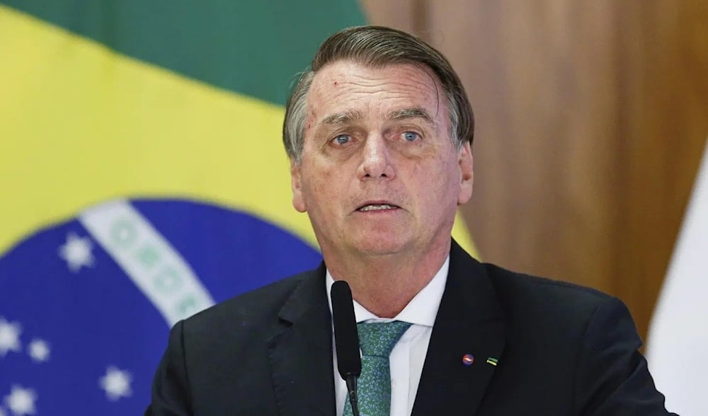 Former Brazilian President Jair Bolsonaro speaks during a joint press conference with Paraguay's president at the Planalto Palace in Brasilia, November 24, 2021. (AP)