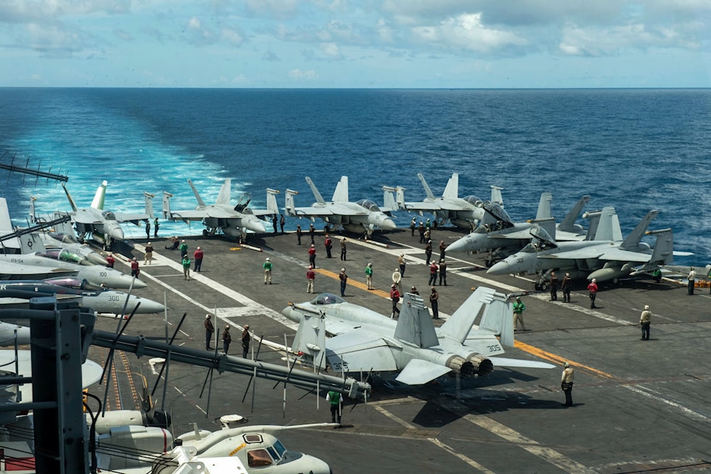 In this photograph released by the U.S. Navy, the flight deck of the Nimitz-class aircraft carrier USS Theodore Roosevelt is seen July 4, 2024, in the South China Sea.