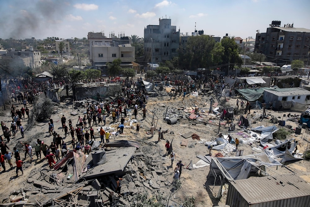 Palestinians inspect the damage at a site hit by an Israeli bombardment on Khan Younis, southern Gaza Strip, Saturday, July 13, 2024. (AP)