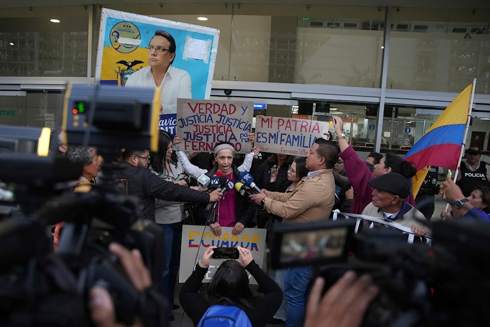 Alexandra Villavicencio, sister of slain presidential candidate Fernando Villavicencio, gives statements to the press after the reading of the sentence of those charged with the murder of Villavicencio, in Quito, Ecuador, July 12, 2024 (AP)