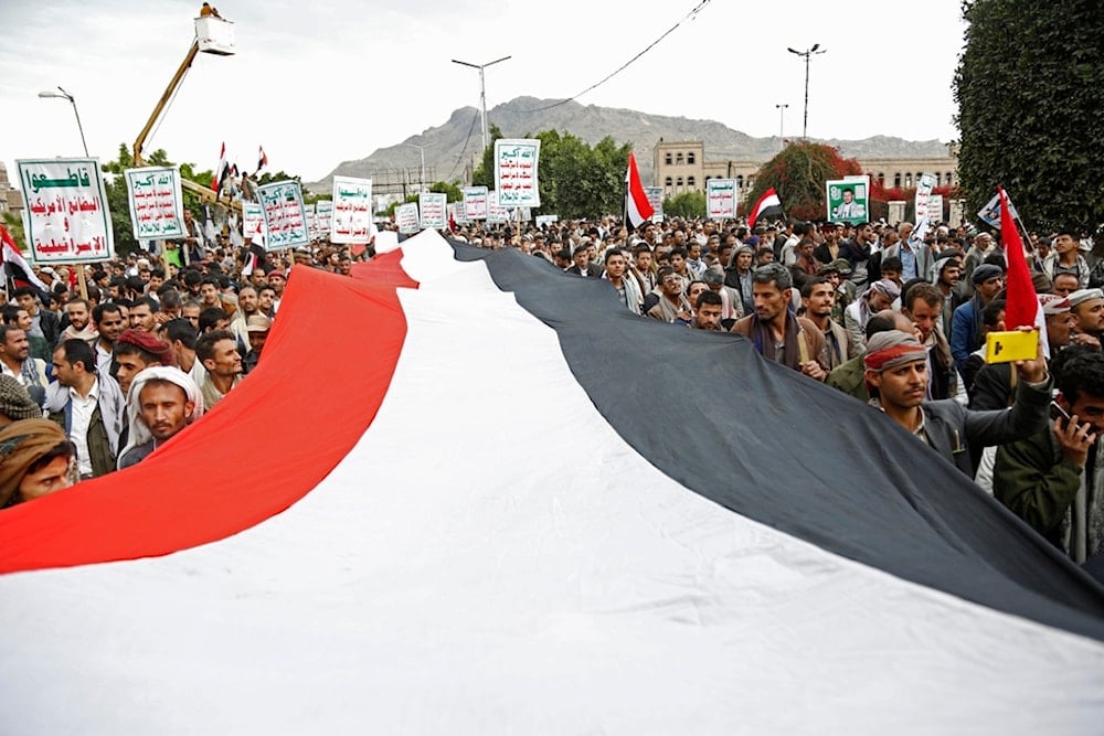 Ansar Allah supporters chant slogans as they attend a rally marking eight years for a Saudi-led coalition, Friday, March 26, 2023, in Sanaa, Yemen. (AP)