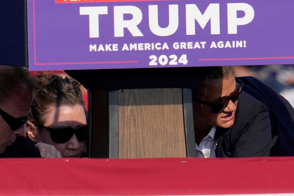 Members of the U.S. Secret Service surround Republican presidential candidate former President Donald Trump at a campaign event in Butler, Pa., US, on Saturday, July 13, 2024. (AP)