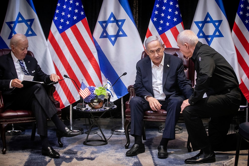 Israeli Prime Minister Benjamin Netanyahu, second right, confers with Security Minister Yoav Gallant, right, during their meeting with US President Joe Biden, left, in Tel Aviv, occupied Palestine, October 18, 2023 (AP)