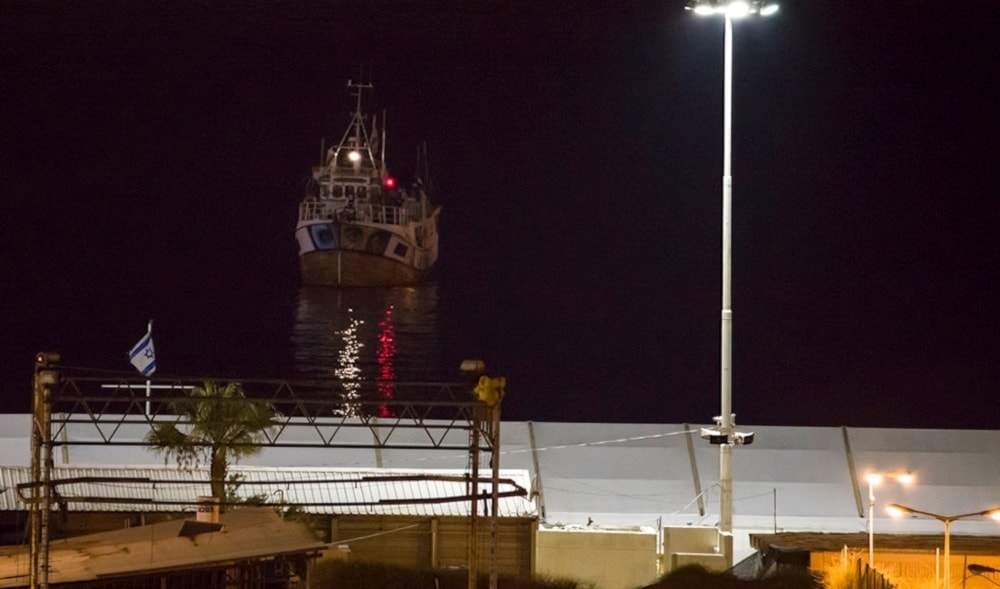 A boat bound to the Gaza Strip arrives to Asdod port, occupied Palestine, Sunday, July 29,2018 (AP)