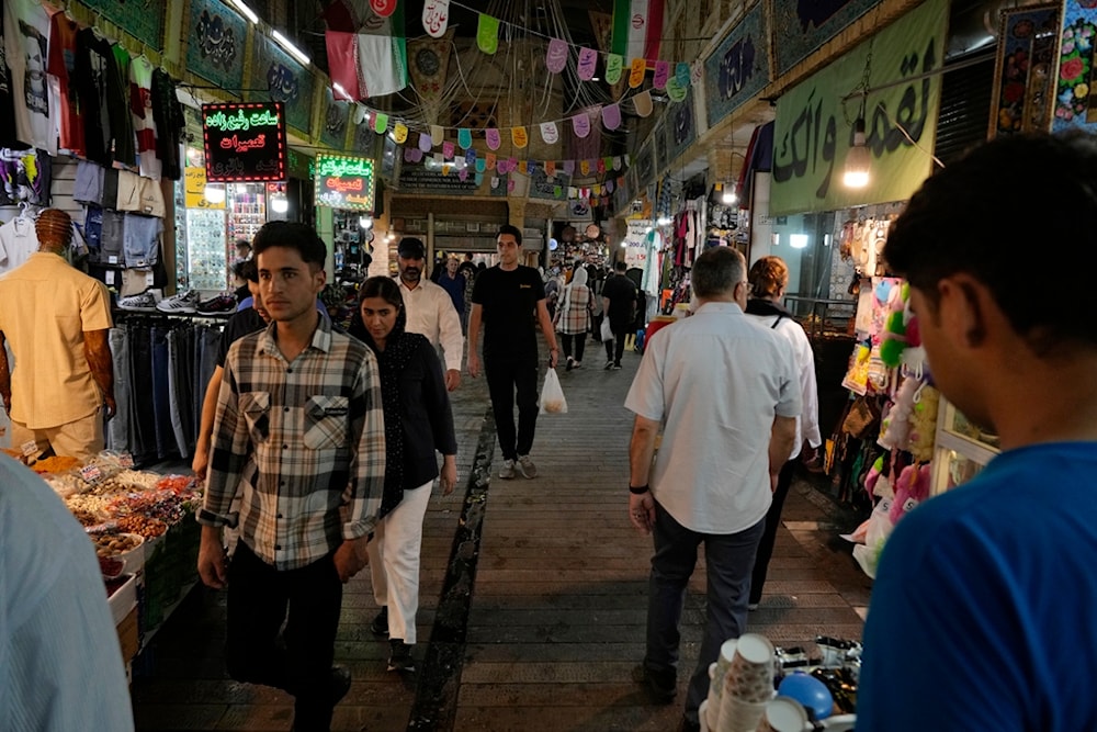 People walk through the Tajrish traditional bazaar in northern Tehran, Iran, Tuesday, July 2, 2024. (AP)