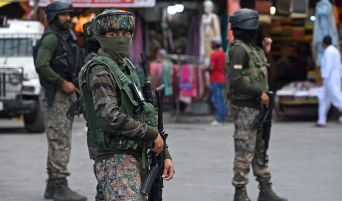 Indian paramilitary troopers stand guard in Srinagar, Kashmir, on August 14, 2023. (AFP)